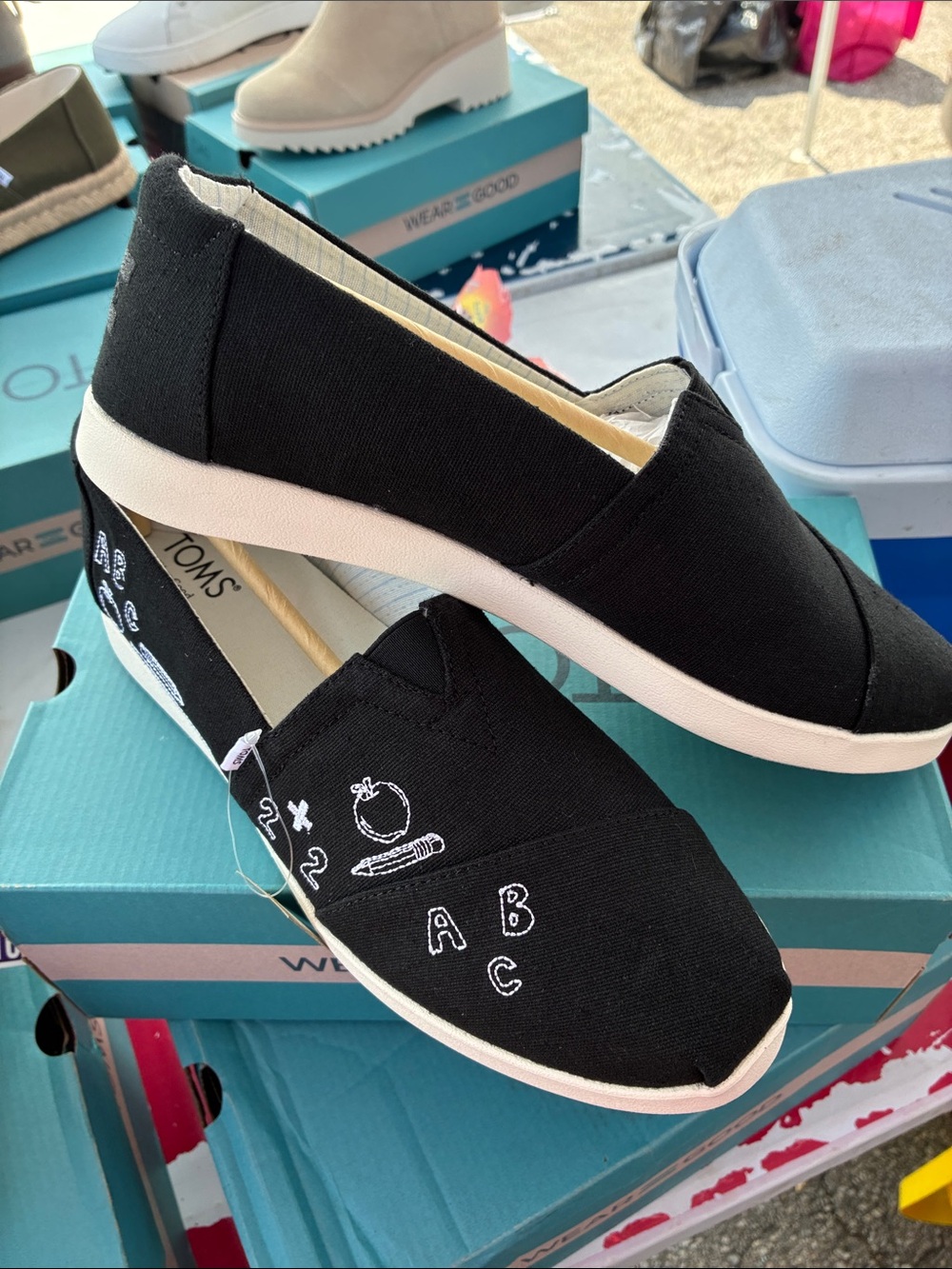 Toms Black Canvas Slip-Ons with White School Doodle Embroidery